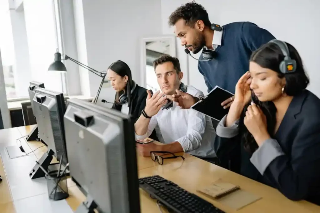 Cold Calling Agents collaborating in office